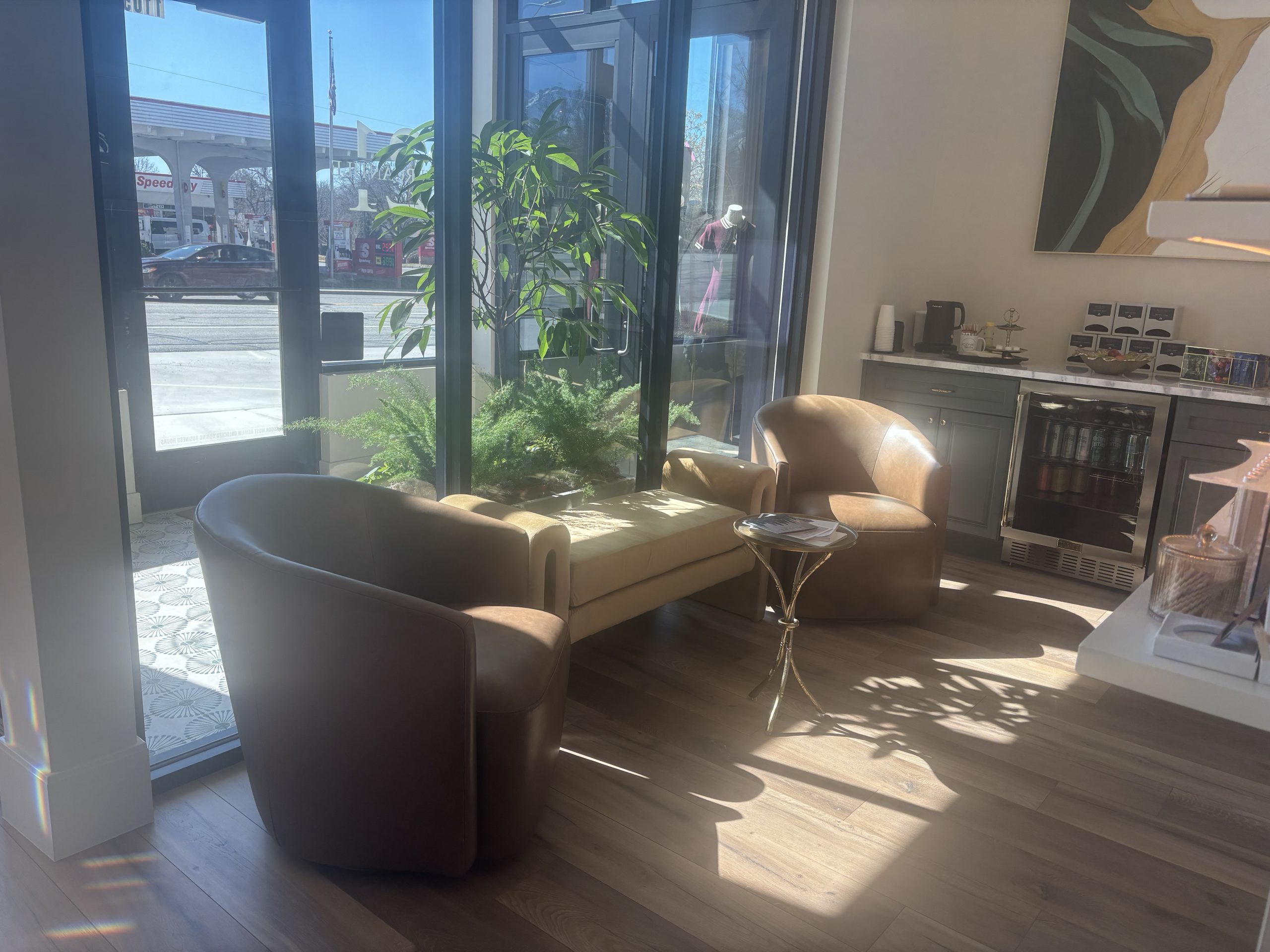 Sunlit lounge seating inside the Iconic Skin boutique in Sugar House, Salt Lake City